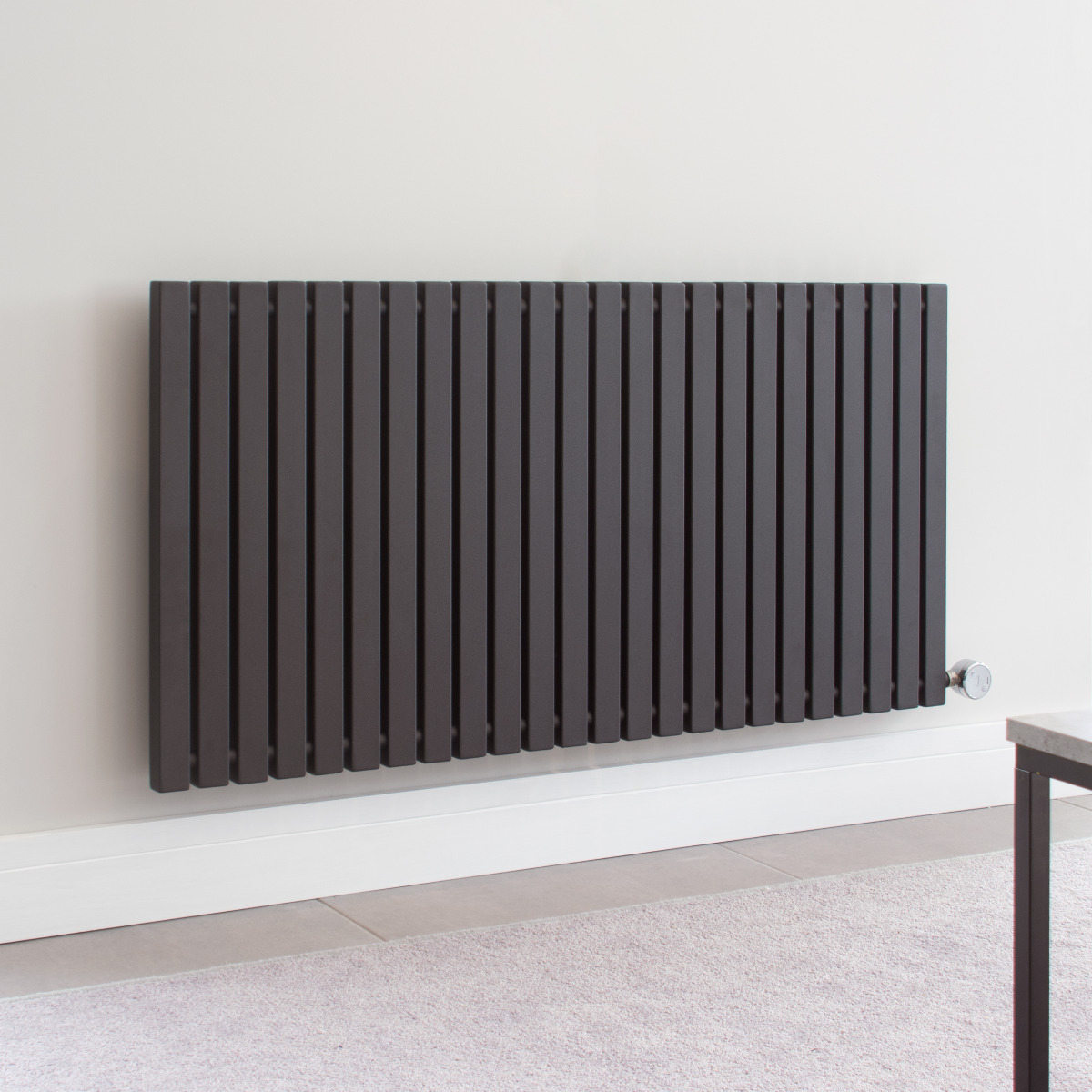Ecostrad Adesso electric radiator installed on wall