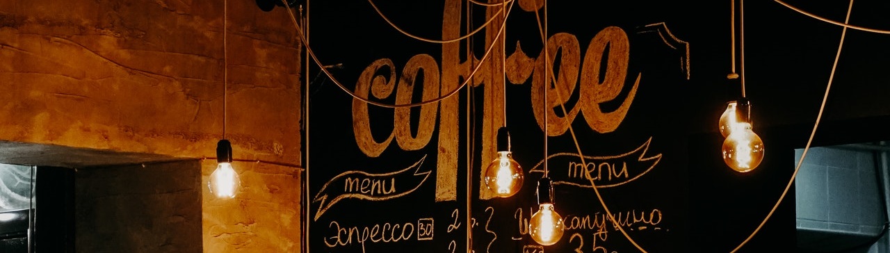 Incandescent bulbs hanging from cafe ceiling